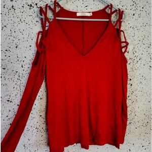 Brand new JustFab long sleeve top with cut-out, crisscross shoulders. Never worn
